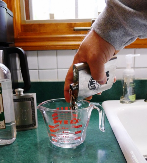 Empty the water into the measuring cup