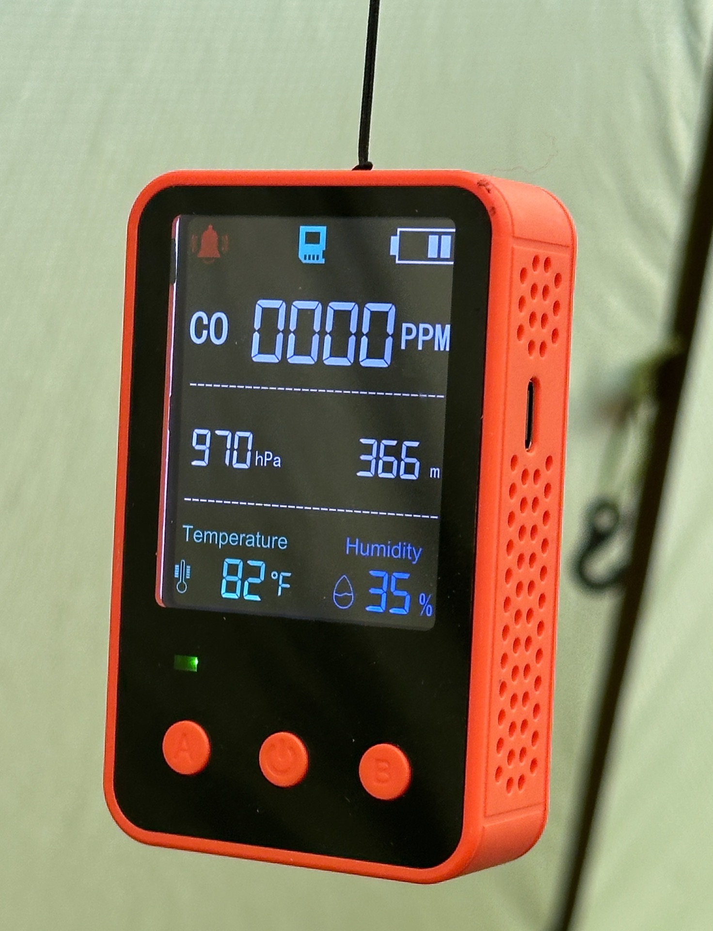 Digital CO meter showing 82 degrees inside hot tent