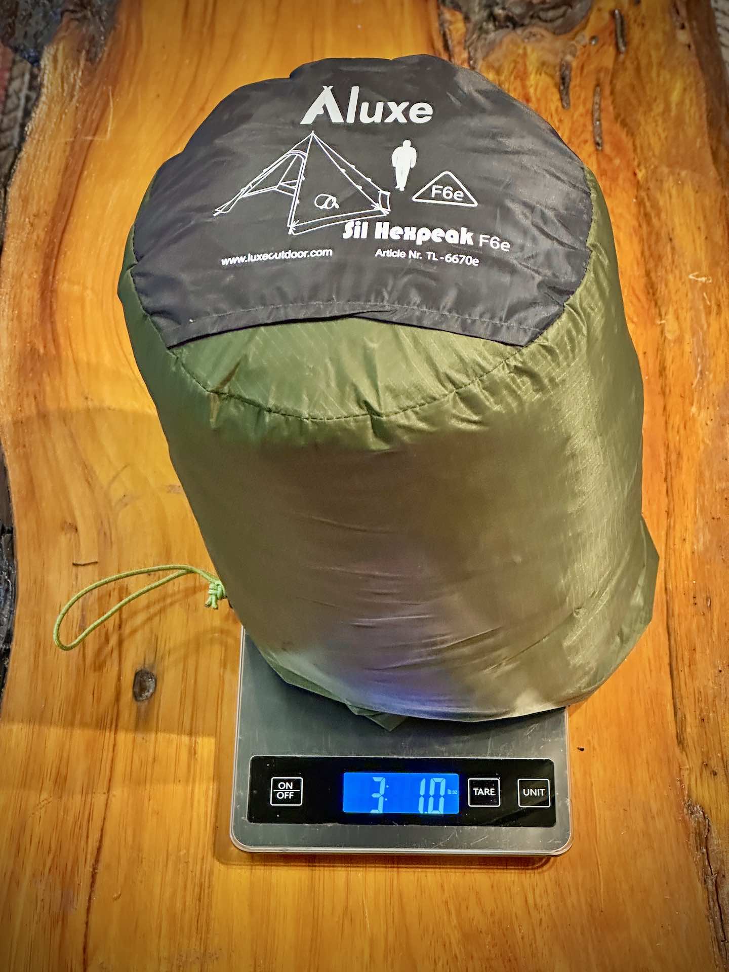 Tent in bag sitting on digital scale showing 3 lbs 11 OZ