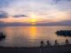 four people ride fat bikes at sunrise on Klode Beach in Whirefish Bay, WI